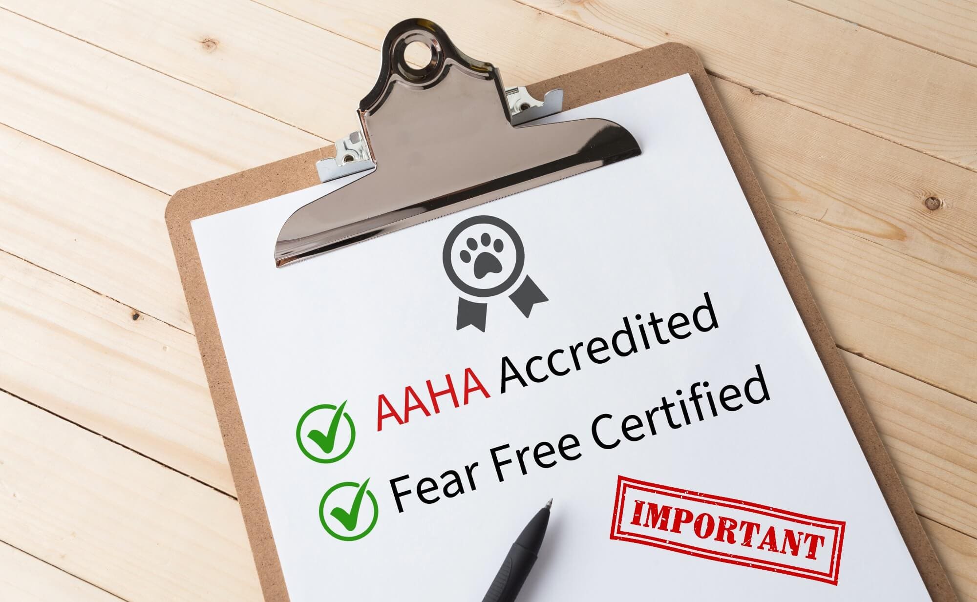 Clipboard with checkmarks for AAHA accredited and Fear Free Certified