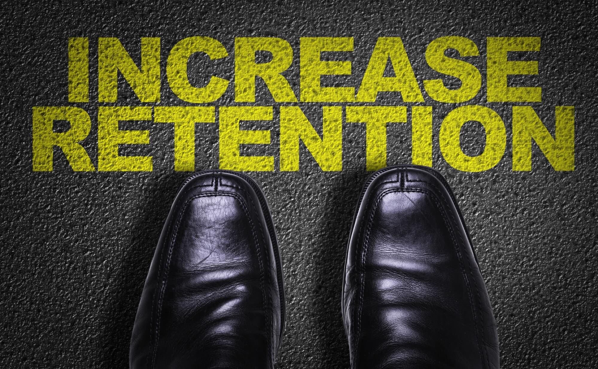men's shoes standing in front of the words "Increase Rentention"