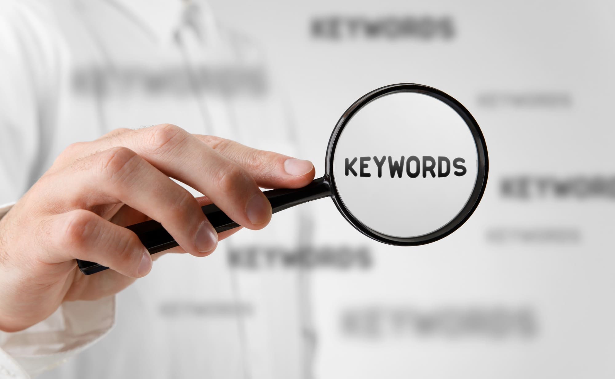 magnifying glass that says "keywords" in the middle